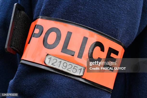 This photograph shows the French "Police judiciaire" logo during a gathering to show support for Judicial Police director Eric Arella after he was...