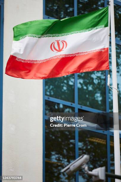 Flag of Iran is seen as human rights activists of Amnesty International stage a protest outside the embassy of Iran on October 7, 2022 in The Hague,...