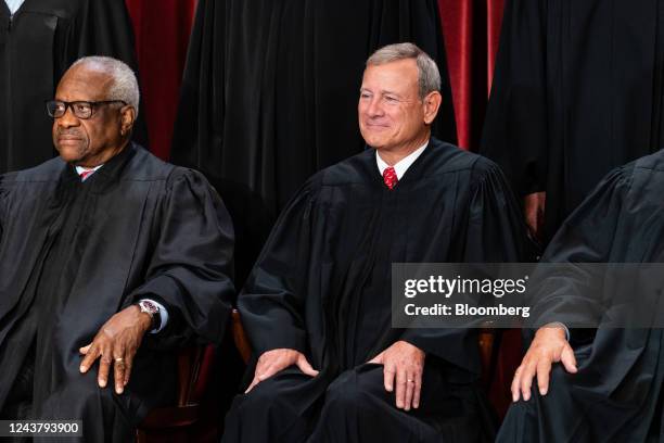 Associate Justice Clarence Thomas, left, and Chief Justice John Roberts during the formal group photograph at the Supreme Court in Washington, DC,...