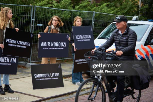 Human rights activists of Amnesty International stage a protest outside the embassy of Iran on October 7, 2022 in The Hague, Netherlands. Human...