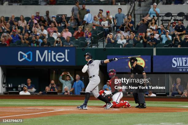 Aaron Judge of the New York Yankees hits his 62nd home run of the season, breaking the American League home run record against the Texas Rangers at...