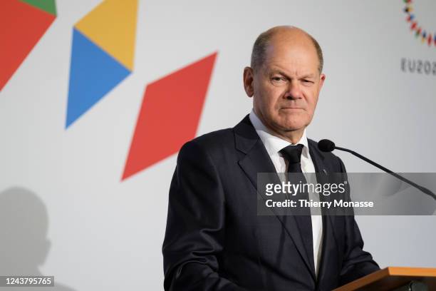 German Chancellor Olaf Scholz talks to media at the end of an informal EU leaders summit in Prague Castel on October 7, 2022 in Prague, Czech...
