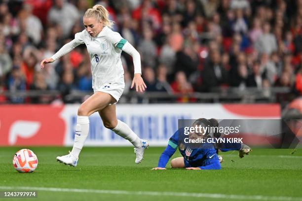 England's defender Alex Greenwood runs with the ball past USA's forward Sophia Smith during the Women's friendly football match between England and...