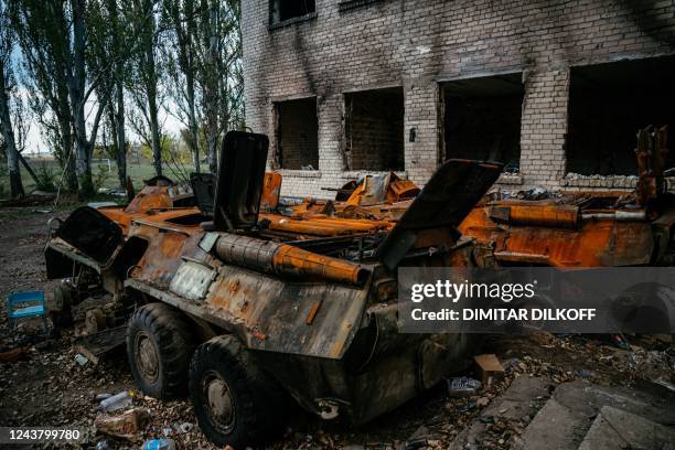 This photograph taken on October 7, 2022 shows destroyed Russian APC in the village of Khreschenivka, in a part of Southern Ukraine which has...