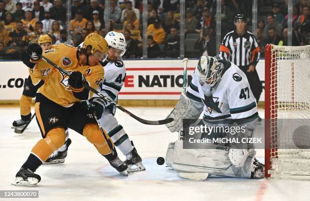 Mikael Granlund of Nashville Predators fights for a puck with Marc-Edouard Vlasic of San Jose Sharks during the NHL Global Series Ice Hockey match...