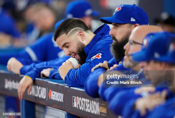 Alek Manoah of the Toronto Blue Jays looks on from the dugout as they play the Seattle Mariners during the second inning in Game One of their AL Wild...