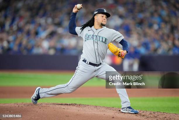 Luis Castillo of the Seattle Mariners pitches to the Toronto Blue Jays during the first inning in Game One of their AL Wild Card series at Rogers...