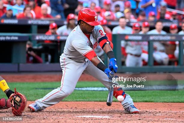 Jean Segura of the Philadelphia Phillies hits a two-run single against the St. Louis Cardinals in the ninth inning during Game One of the NL Wild...