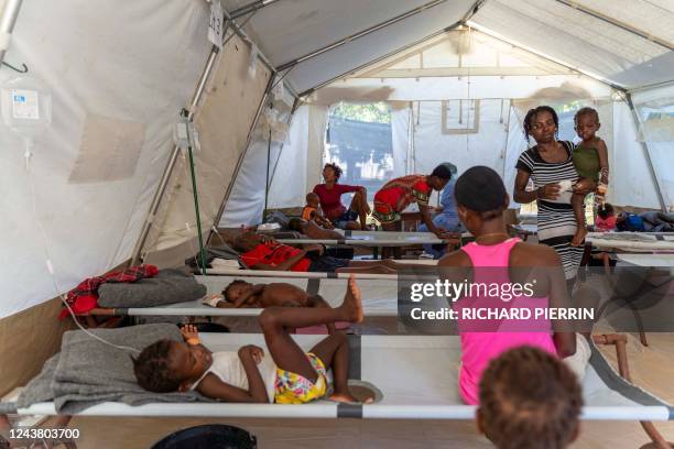 People showing symptoms of cholera receive treatment at a clinic run by Doctors Without Borders in Cité Soleil a densely populated commune of...