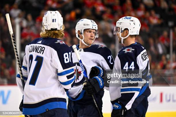 Winnipeg Jets Left Wing Kyle Connor , Winnipeg Jets Right Wing Nikolaj Ehlers and Winnipeg Jets Defenceman Josh Morrissey talk strategy during the...