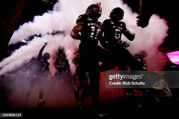 The Rutgers Scarlet Knights charge onto the field before of a game against the Nebraska Cornhuskers at SHI Stadium on October 7, 2022 in Piscataway,...