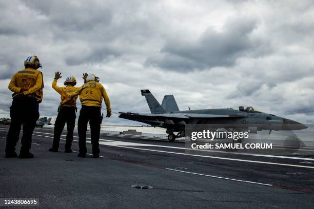 Super Hornet is caught by the Advance Arresting Gear as it lands on the flight deck of the USS Gerald Ford in the Atlantic Ocean off the coast of the...