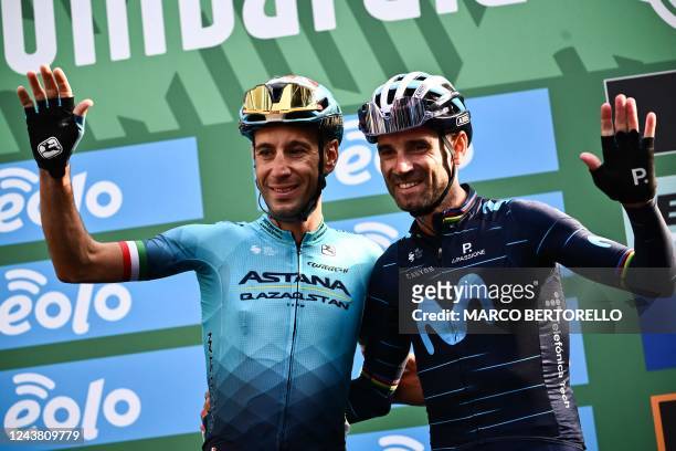 Team Astana's Italian rider Vincenzo Nibali and Team Movistar's Spanish rider Alejandro Valverde wave as they participate to their last professional...
