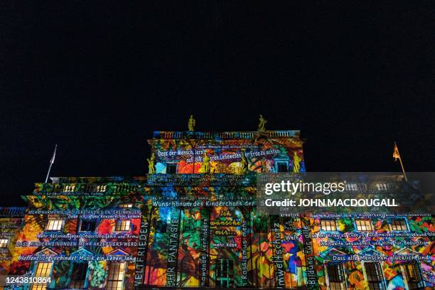 Ight installation featuring people's wishes appears on the facade of the Berlin State Opera during the yearly Festival of Lights in Berlin on October...