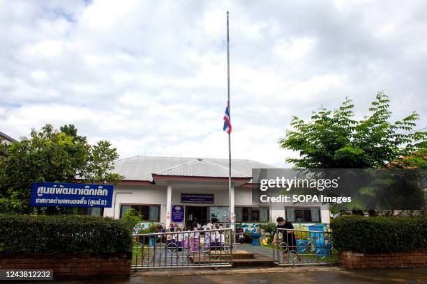 Flag flys at half-mast at a daycare center in Chiang Mai as they mourn and pay their respects. Police Corporal Panya Kamlarb, a 34-year-old former...