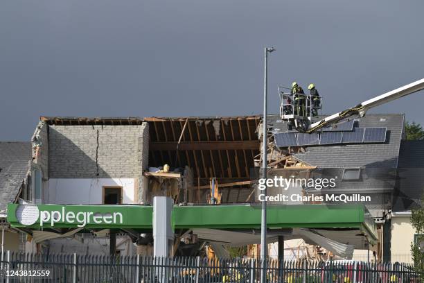 Emergency services attend the scene following an explosion at a petrol station in Donegal on October 8, 2022 in Creeslough, Ireland. The explosion...