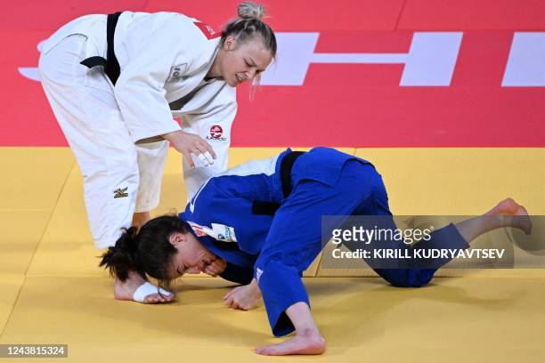 Canada's Jessica Klimkait and Israel's Timna Nelson Levy compete in their women's under 57 kg category bronze bout during the 2022 World Judo...
