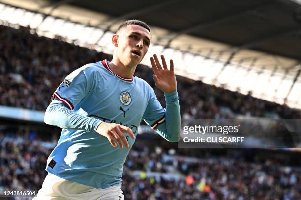 Manchester City's English midfielder Phil Foden celebrates scoring the team's second goal during the English Premier League football match between...