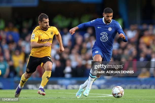 Wolverhampton Wanderers' Spanish defender Jonny Otto vies with Chelsea's English midfielder Ruben Loftus-Cheek during the English Premier League...