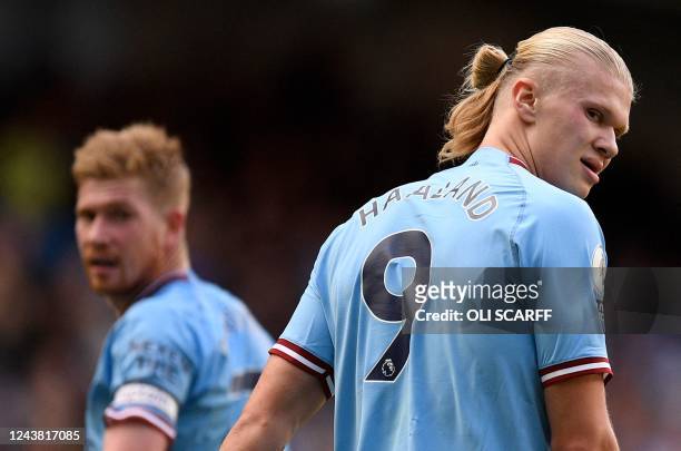 Manchester City's Belgian midfielder Kevin De Bruyne and Manchester City's Norwegian striker Erling Haaland react during the English Premier League...
