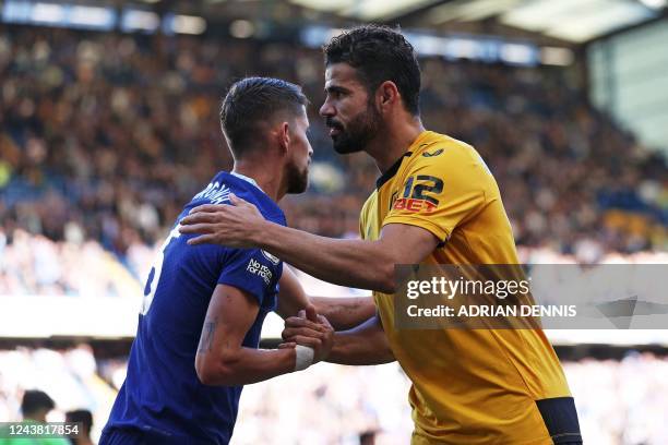 Chelsea's Italian midfielder Jorginho shakes hands with Wolverhampton Wanderers' Brazilian born Spanish striker Diego Costa as Costa is substituted...