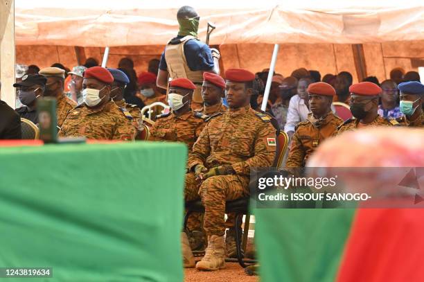 Burkina Faso's new junta leader Capitain Ibrahim Traore attends the funerals of 27 soldiers killed as they escorted 207-vehicles in a convoy in...