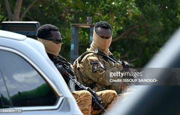 Soldiers guard the General Sangoule Lamizana military camp in Ouagadougou on October 8 during the funerals of 27 soldiers killed as they escorted...