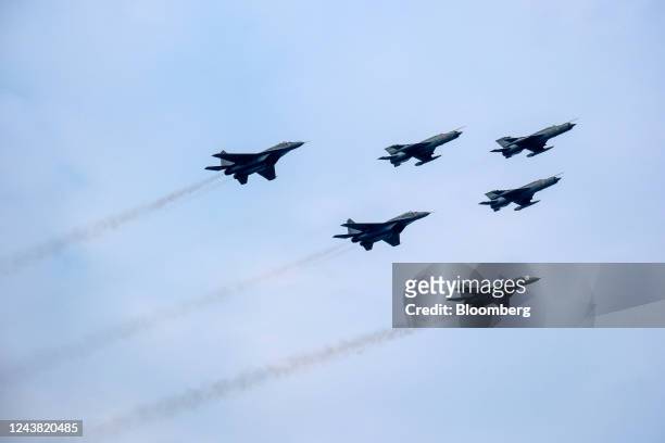 Indian Air Force MIG-21 and MIG-29 perform during the Indian Air Force Day at Sukhna Lake in Chandigarh, India, on Saturday, Oct. 8, 2022. The...