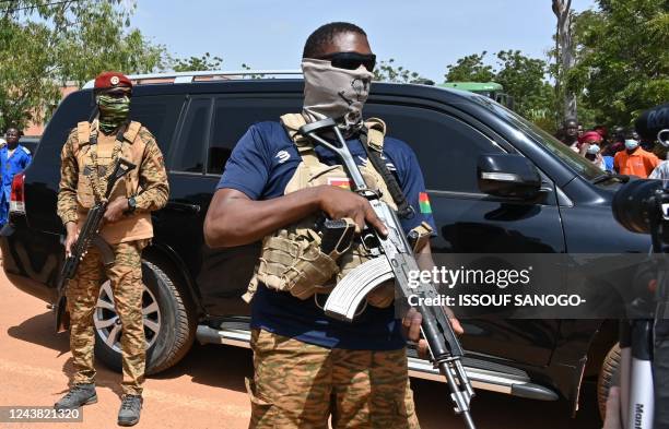 The vehicle carrying Burkina Faso's new junta leader Capitain Ibrahim Traore leaves the General Sangoule Lamizana military camp in Ouagadougou on...