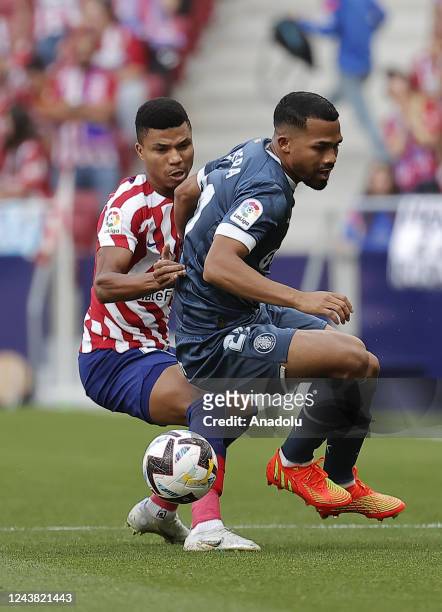 Reinildo Mandava of Atletico Madrid in action against Yangel Herrera of Girona during the LaLiga week 8 soccer match between Atletico Madrid and...