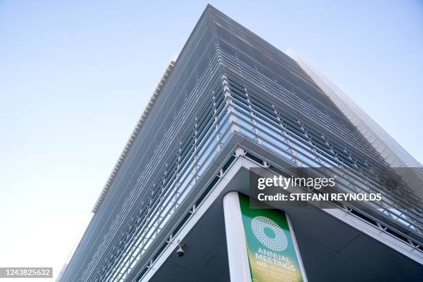 Sign for the International Monetary Fund annual Fall Meetings is displayed at the World Bank headquarters in Washington, DC, on October 8, 2022. -...