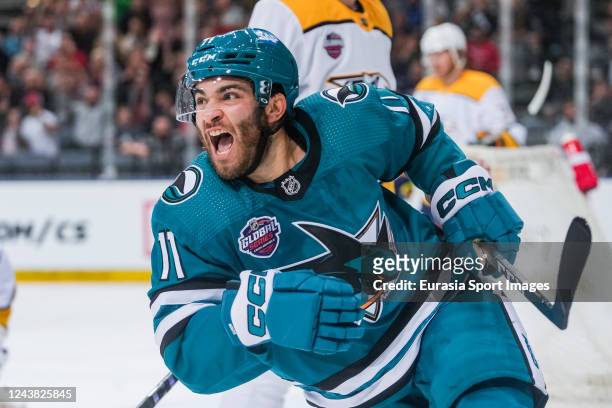 Luke Kunin of the San Jose Sharks celebrates his goal against the Nashville Predators in the first period during the 2022 NHL Global Series Challenge...