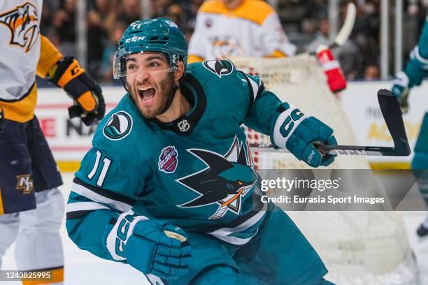 Luke Kunin of the San Jose Sharks celebrates his goal against the Nashville Predators in the first period during the 2022 NHL Global Series Challenge...