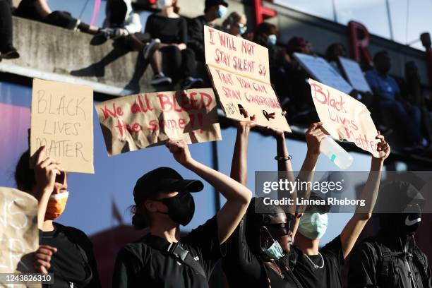 Protesters participate in a demonstration in solidarity with the Black Lives Matter movement and against police brutality at Sergels Torg on June 03,...