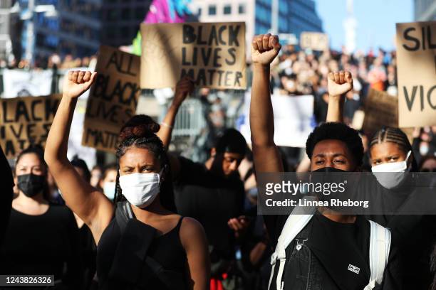 Protesters participate in a demonstration in solidarity with the Black Lives Matter movement and against police brutality at Sergels Torg on June 03,...