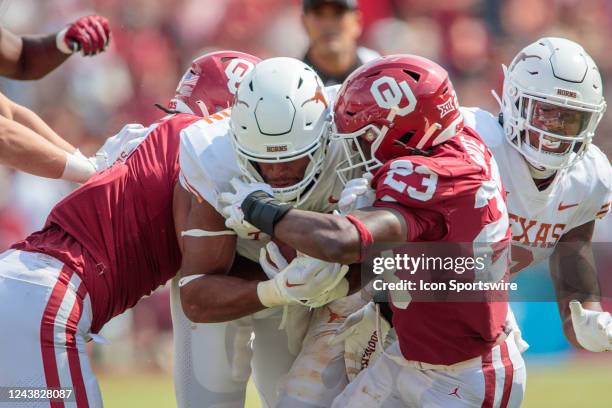 Texas Longhorns running back Bijan Robinson tries to break through the line during the second half against the Oklahoma Sooners on October 8th 2022...