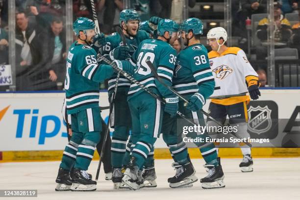 Logan Couture of the San Jose Sharks celebrates his goal against the Nashville Predators in the second period with teammates during the 2022 NHL...