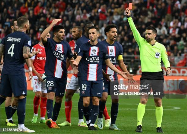 Paris Saint-Germain's Spanish defender Sergio Ramos receives a red card from French referee Pierre Gaillouste during the French L1 football match...