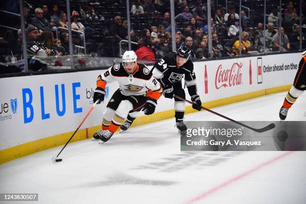 Dmitry Kulikov of the Anaheim Ducks and Arthur Kaliyev of the Los Angeles Kings battle for possession during the Los Angeles Kings against the...
