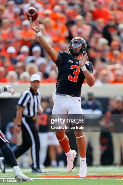 Quarterback Spencer Sanders of the Oklahoma State Cowboys launches the ball for a 28-yard pass against the Texas Tech Red Raiders in the second...