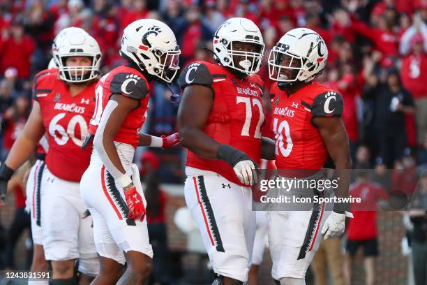 Cincinnati Bearcats running back Charles McClelland reacts with his teammates after scoring a touchdown during the game against the South Florida...