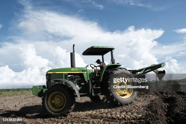 Motorized tractor plows the soil in preparation for planting season at a sugarcane farm in Victorias City, Negros Occidental, the Philippines, on...
