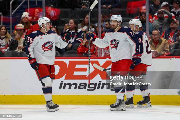 Sean Kuraly, Mathieu Olivier and Eric Robinson of the Columbus Blue Jackets celebrate a goal during a pre-season game against the Washington Capitals...