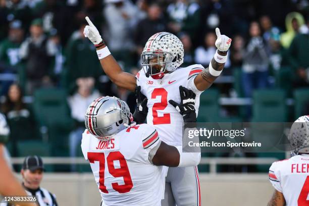 Ohio State Buckeyes wide receiver Emeka Egbuka celebrates a touchdown with offensive lineman Dawand Jones during a college football game between the...