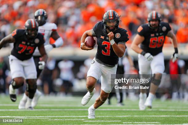 Quarterback Spencer Sanders of the Oklahoma State Cowboys runs for nine yards and a first down to set up the go-ahead field goal late in the third...