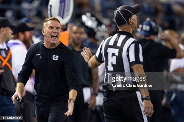 Blake Anderson head coach of the Utah State Aggies shouts at Field Judge Matthew Mills during the second half of their game against the Air Force...