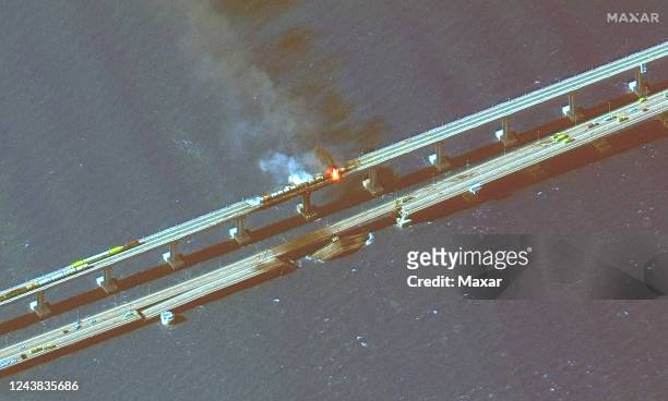 Maxar infra-red closeup satellite imagery of burning rail cars and the damage to the Kerch Bridge in Crimea. Please use: Satellite image 2022 Maxar...