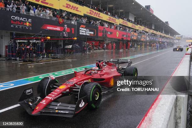 Ferrari's Monegasque driver Charles Leclerc drives in the pit lane during the Formula One Japanese Grand Prix at Suzuka, Mie prefecture on October 9,...