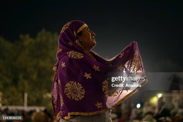 Kashmiri woman supplicates before the dawn prayers on the occasion of celebration of Mawlid al-Nabi or Prophet Muhammad's birth anniversary in Dargah...