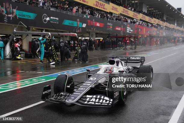 AlphaTauri's French driver Pierre Gasly drives in the pit lane during the Formula One Japanese Grand Prix at Suzuka, Mie prefecture on October 9,...